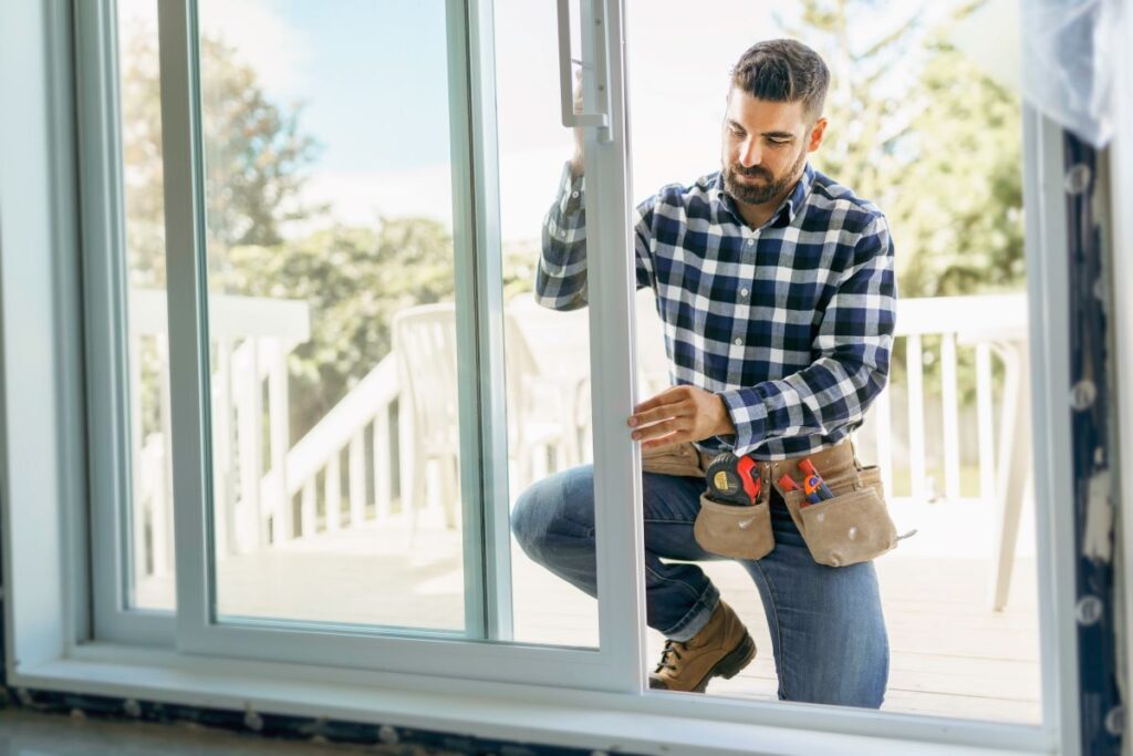 Man installing window